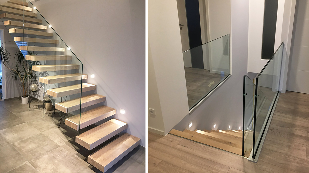 Beleuchtete Kragarmtreppe mit Holzstufen und Glasgeländer von Treppenbau SEIFERT